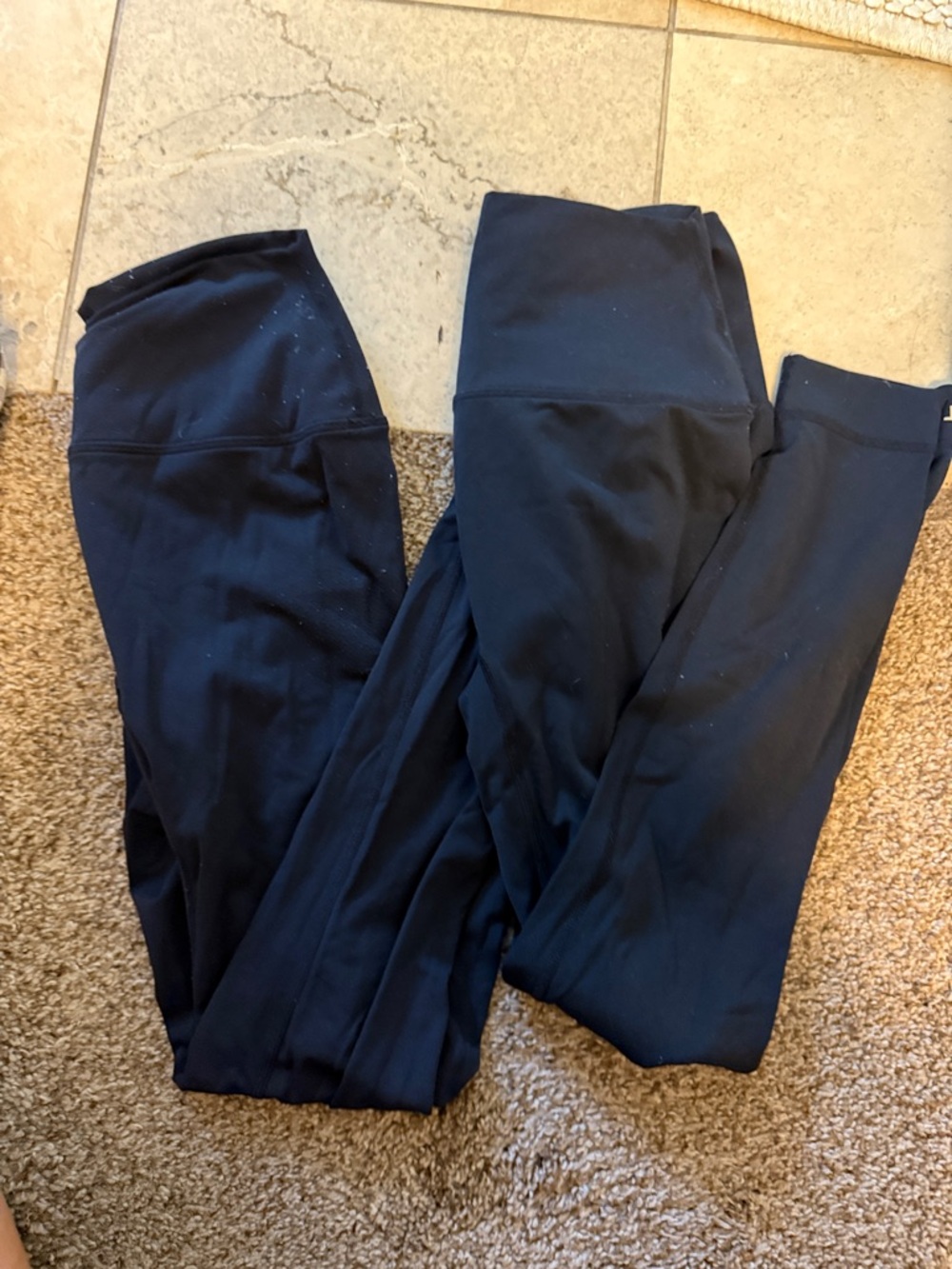 Two pairs of SET Active black airLuxe leggings